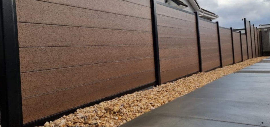 Composite fencing panels installed along a garden boundary